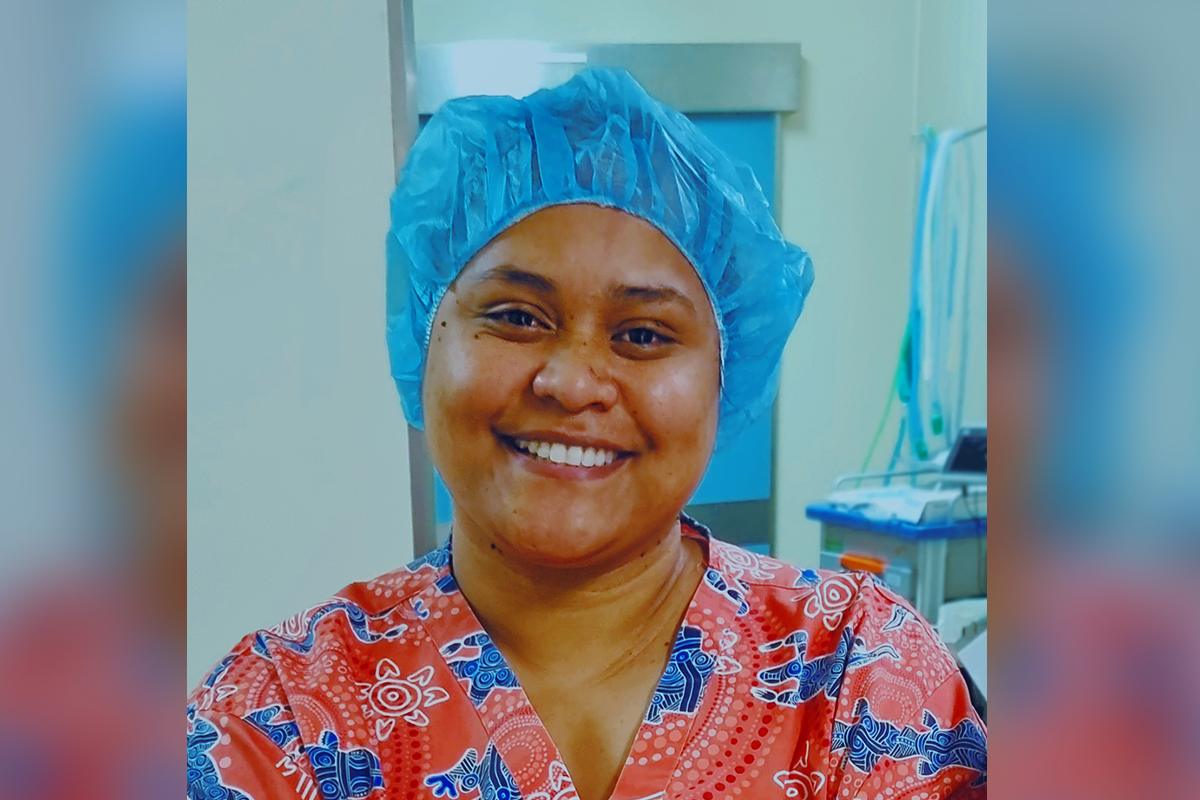 Photo of Dr Fanueli in scrubs and hair net.