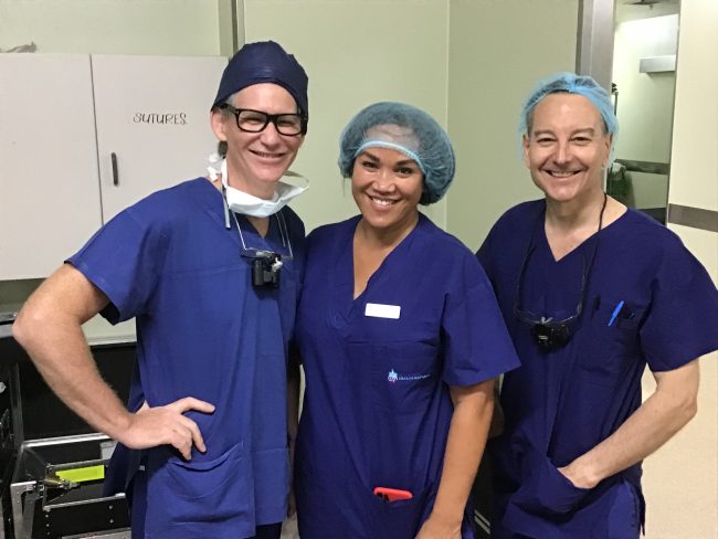 Three Interplast Volunteers smiling at the camera